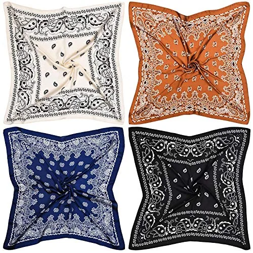 Four Syhood satin squares laid flat in cream, copper, blue and black